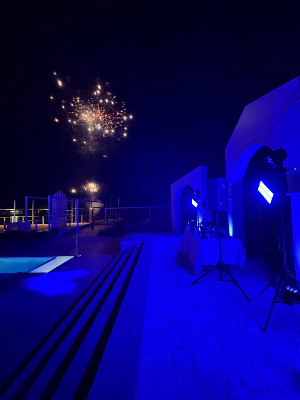 DJ setup with glowing turntables